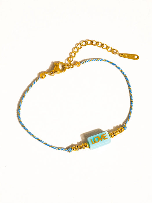 Bracelet Tressé LOVE (plusieurs coloris) par FLÂNERIE • NEW, SUMMER, Summertime